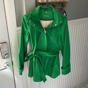 Green Calvin Klein rain coat with hood